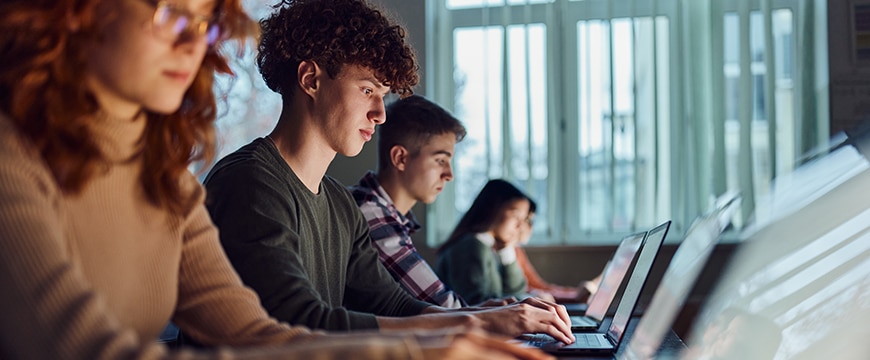 image of college students working inside a computer lab