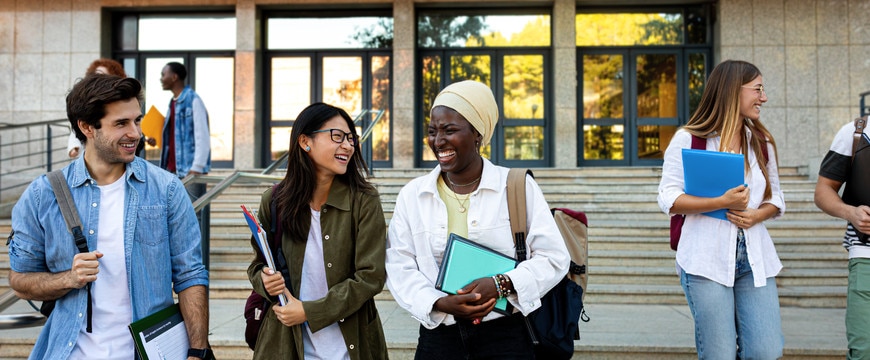 students + university staff in active campus environment