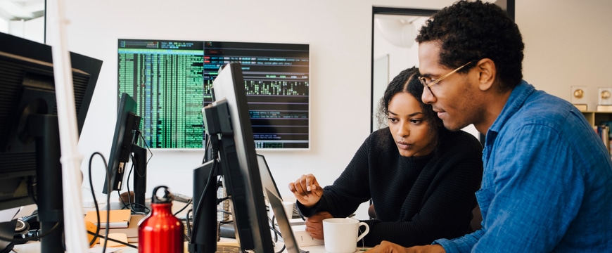 technical teams reviewing systems, screens, or architecture together