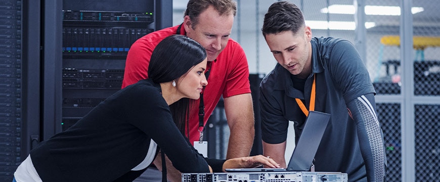 IT professionals collaborating in modern data center with business stakeholders