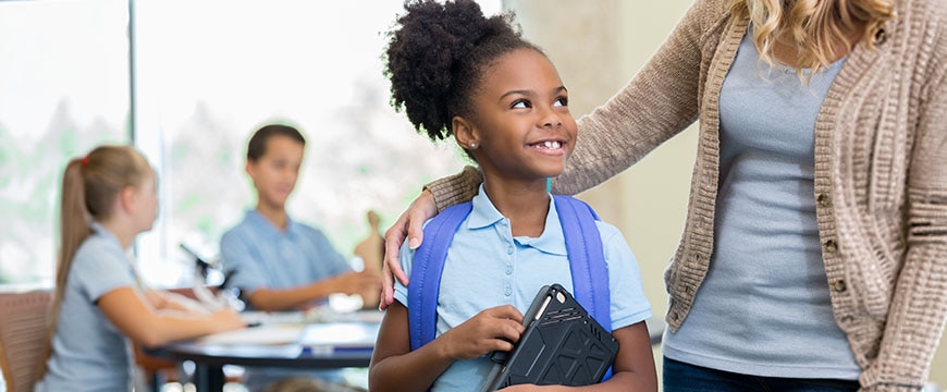 K–12 school administrators reviewing budget with teacher colleagues