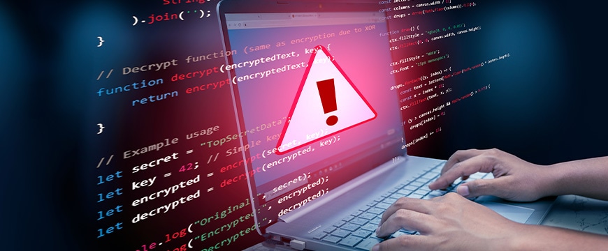 Hands typing on laptop with red warning symbol overlaid on code screen