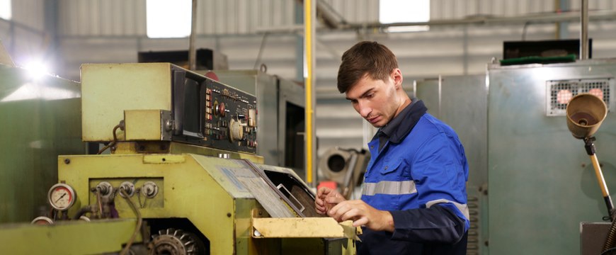 Industrial engineer inspecting machinery work systems