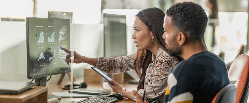 two people looking at a screen