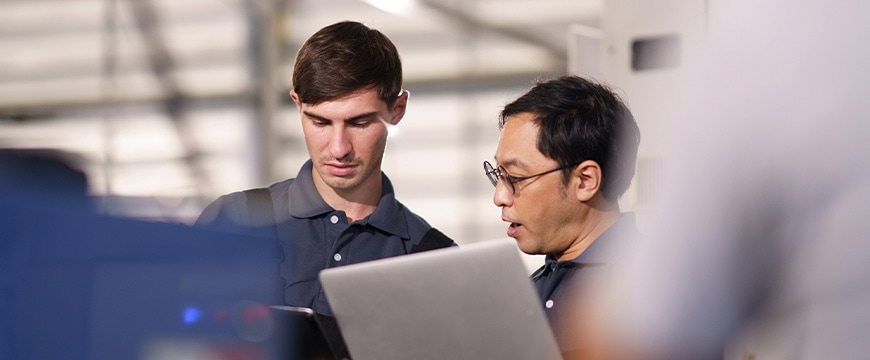 People looking at computer