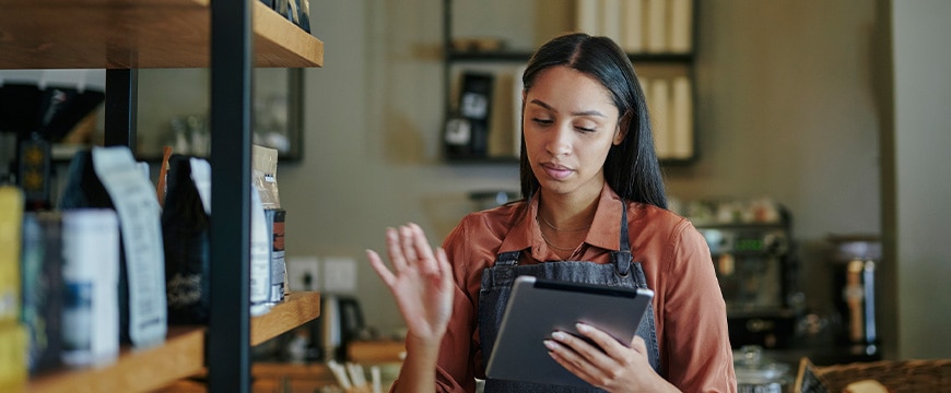 Small business owner using tablet