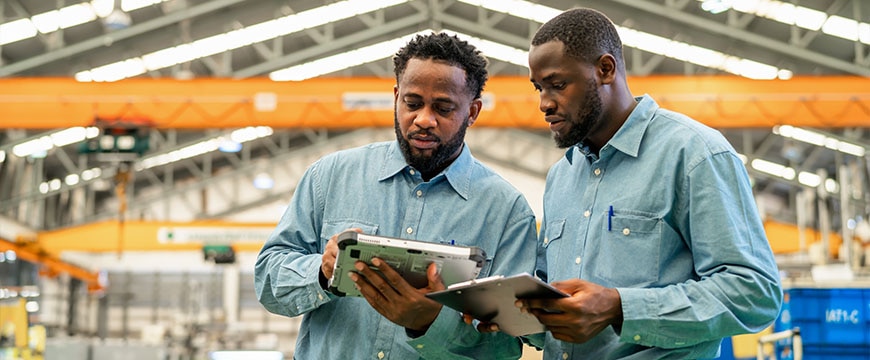 IT engineers conducting wireless site survey in enterprise facility