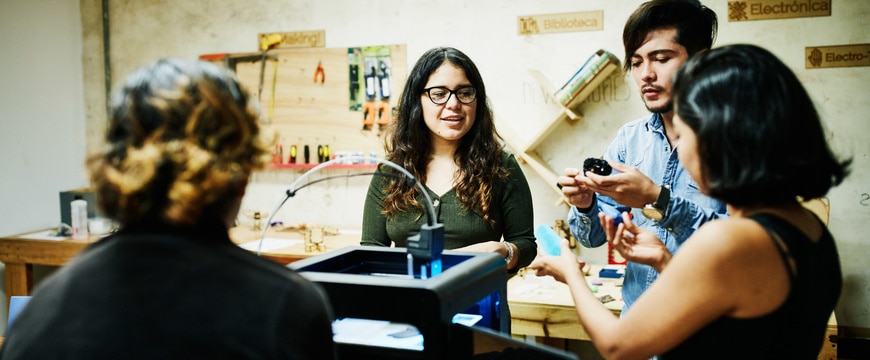 team working with 3d printer