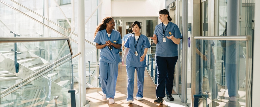 hospital staff communicating announcements over speaker with people present