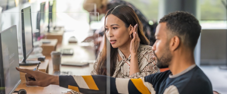 IT professionals analyzing cybersecurity threats in modern office