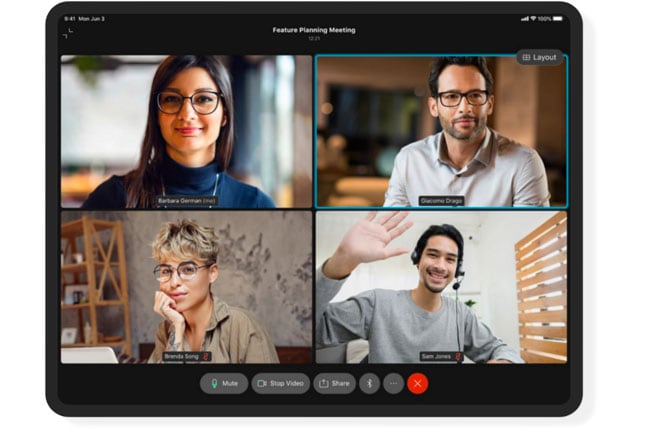 People looking at monitor in outdoor office setting