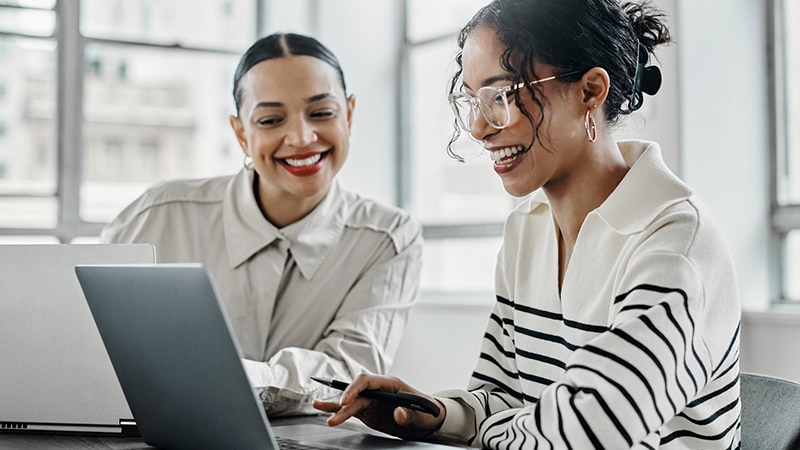 Women collaborating in bright office