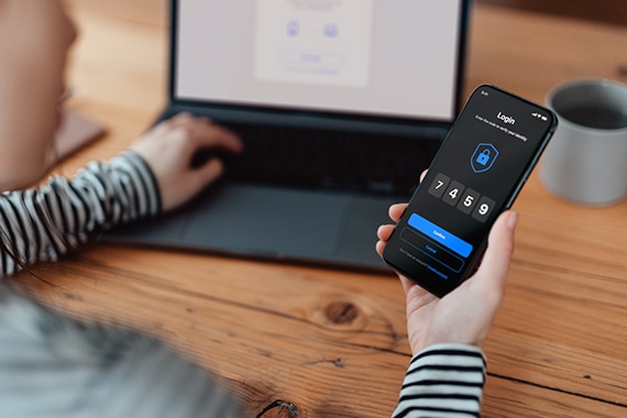 thumbnail image of a woman using two-factor authentication on a smartphone