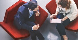 Man and a woman looking at a tablet computer 