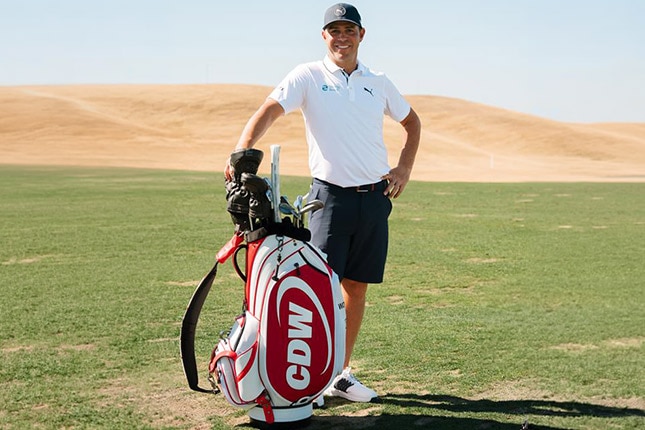 Gary Woodland at the Houston Open golf tournament standing with CDW-branded golf bag on course