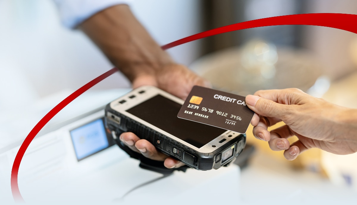 banner image of a customer paying with a credit card for a touchless purchase