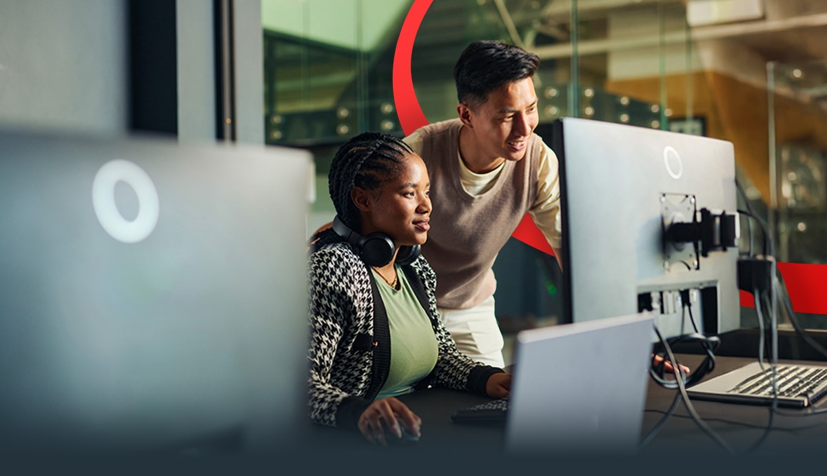 Two IT professionals working at computers on private cloud solutions, managing secure, high-performance enterprise infrastructure