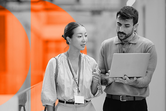 lifestyle card thumbnail image of two coworkers using a shared laptop