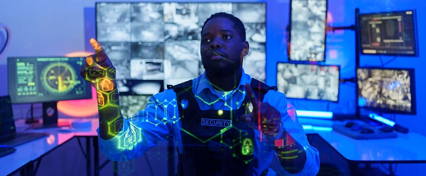 image of a security officer using AI tools to enhance security