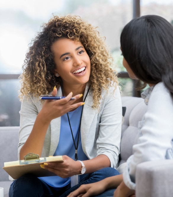 Close up image of a female healthcare worker talking with patient.