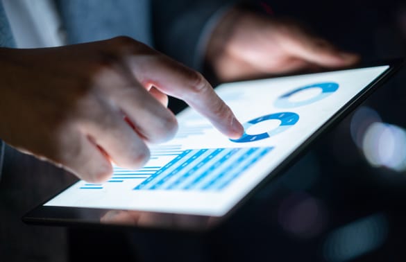 Close up image of person using a tablet device.