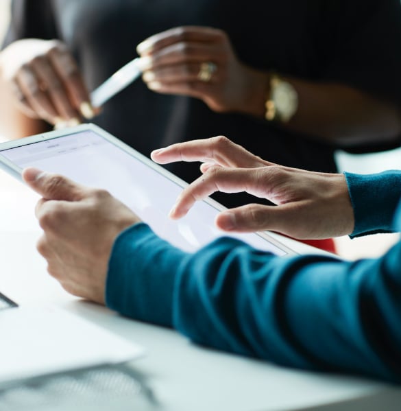 Close up image of a person using a tablet device.