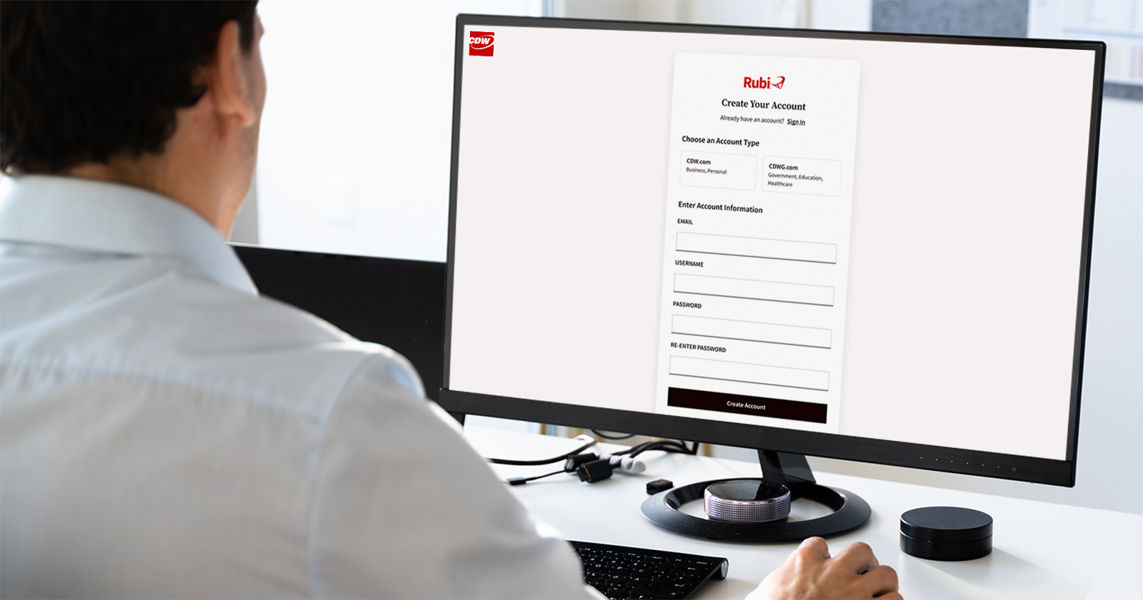 Person Using Desktop Computer to Create Rubi by CDW Account