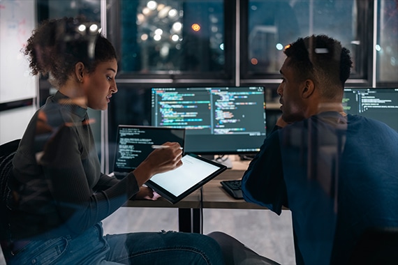 thumbnail image of two developers working in an office environment