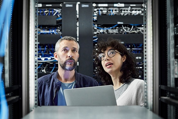 thumbnail image of two IT specialists inside a server room