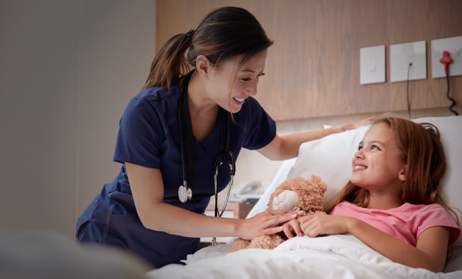 Nurse attending to a child in the hospital