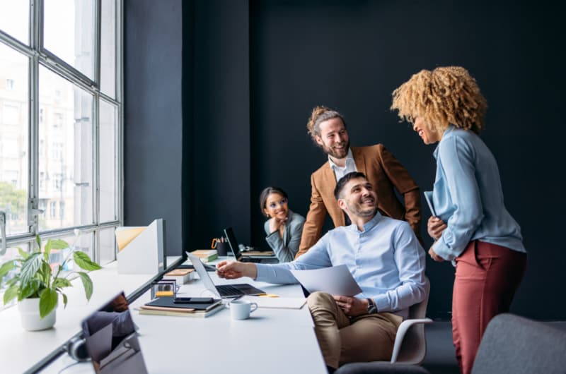 Small business team using laptop computers in an office.