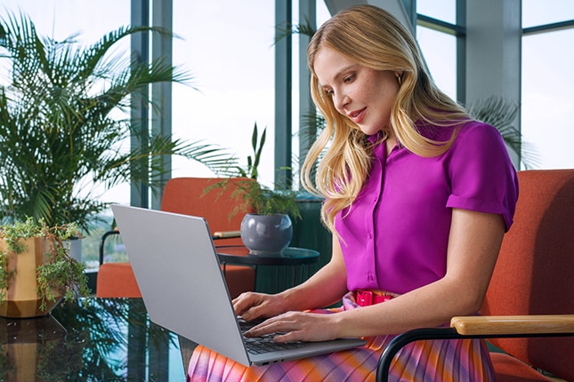 image of a woman working on a laptop computer