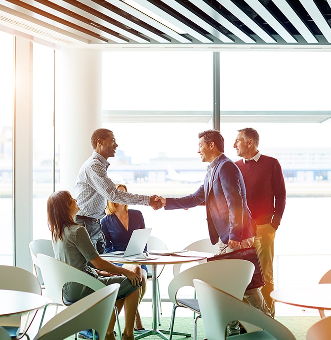 Image of people meeting in lobby.