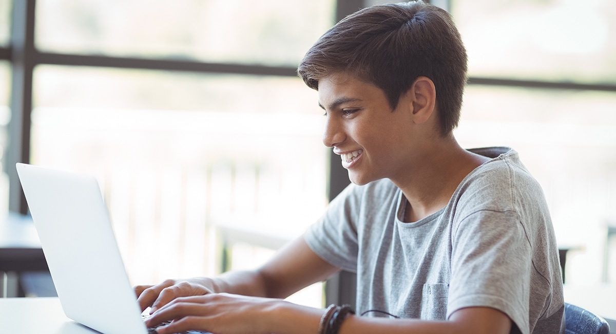 Young students are using laptops in the classroom.