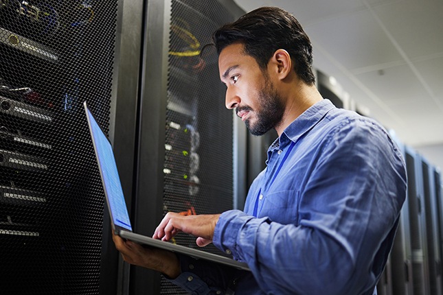 Government worker reviewing security features on laptop.