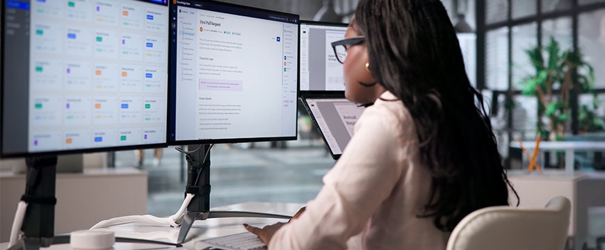 Young Woman Manages Digital Files On Laptop With Smart Software