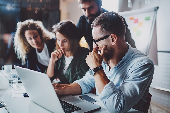 IT team collaborating on modern endpoint management to support device provisioning, automation, and endpoint lifecycle management.