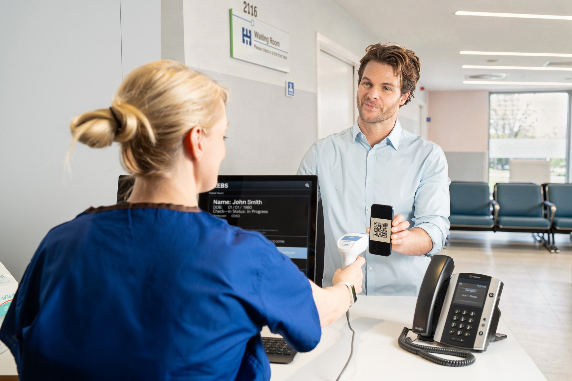 Nurse scanning a QR code on a patient's phone.